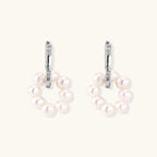 Rhodium-plated silver hoop earrings with freshwater pearls arranged in crescent formation and diamond accents